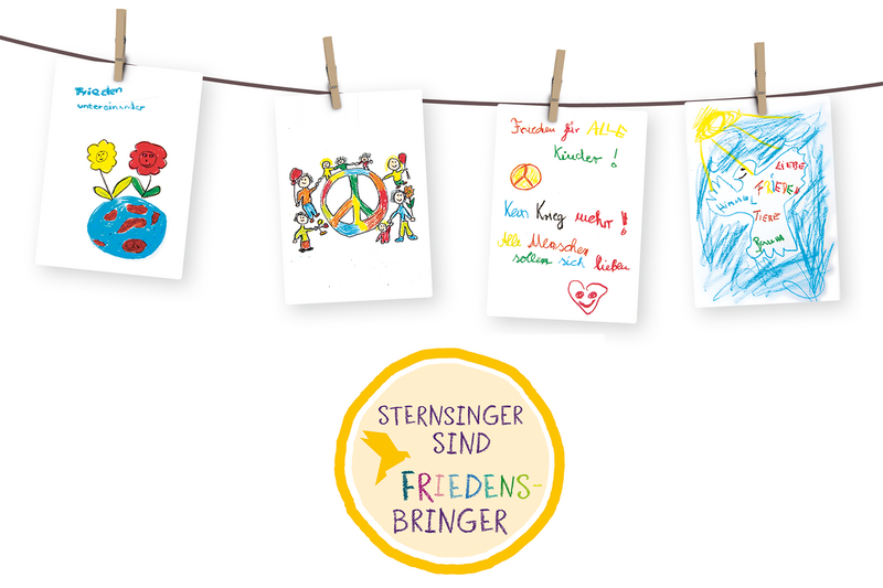Bilder vom Frieden, die Kinder mit bunten Stiften gemalt haben, hängen an einer Wäscheleine