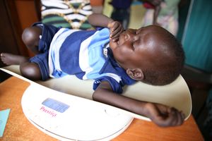 Yak Atiam with his mother Ayak Thiep at wellness clinic in St. Daniel Comboni Hospital, Wau