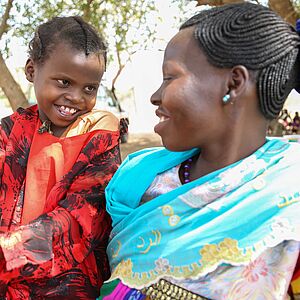 Perinah Joseph Santino with her mother Antoinette Hassan at a mobile clinic in Ngonjeko village, Wau
